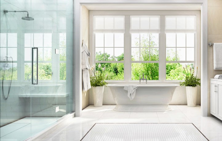A luxurious bathroom with a walk-in shower, freestanding bathtub