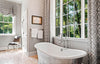 Monochromatic Bathroom with White and Gray Freestanding Tub Under Window